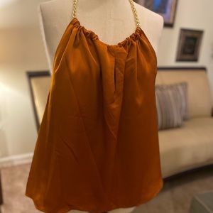 Women’s Open-Back blouse.